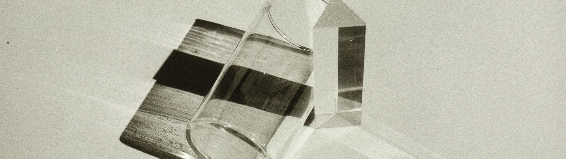 Abstract photo of a glass and prism casting artistic shadows. From Mr Dr3igeteilt in Pexels